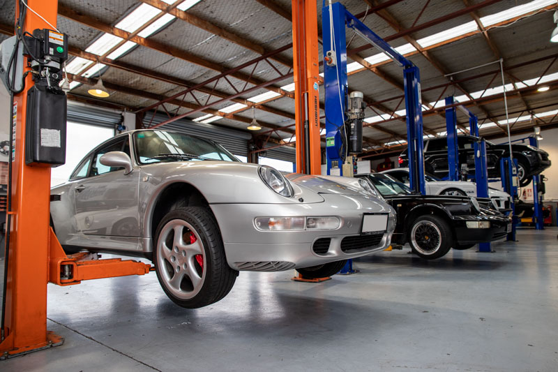 Silver Porsche on hoist